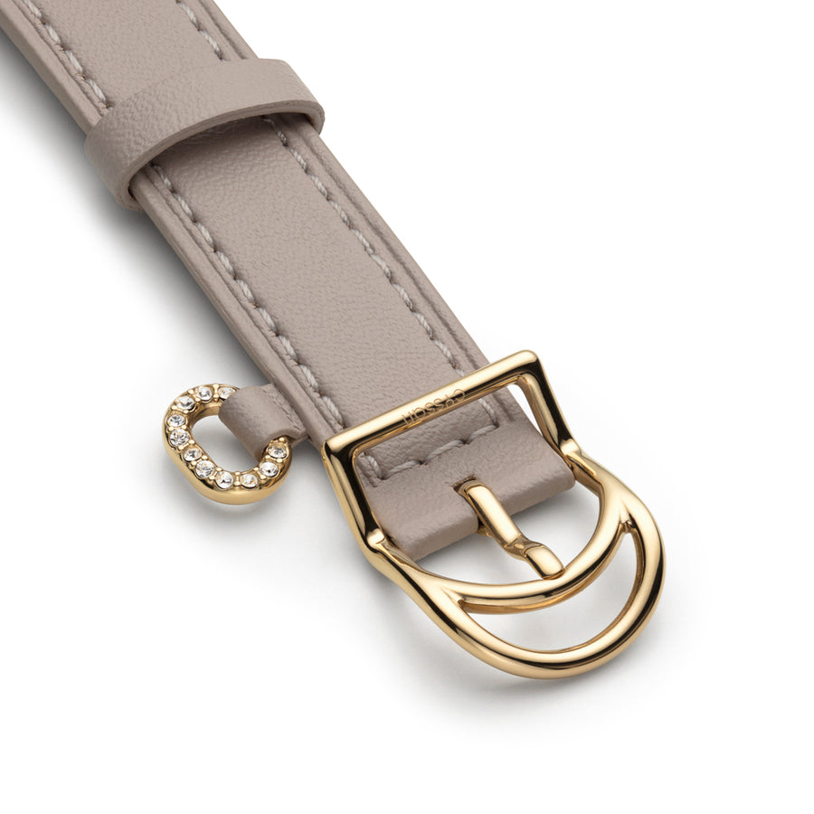 Sand-coloured vegan-leather strap with a gold buckle, and a stone-embellished ring detail.